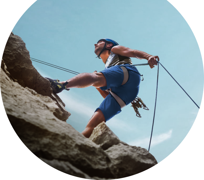 a man climbing on rock